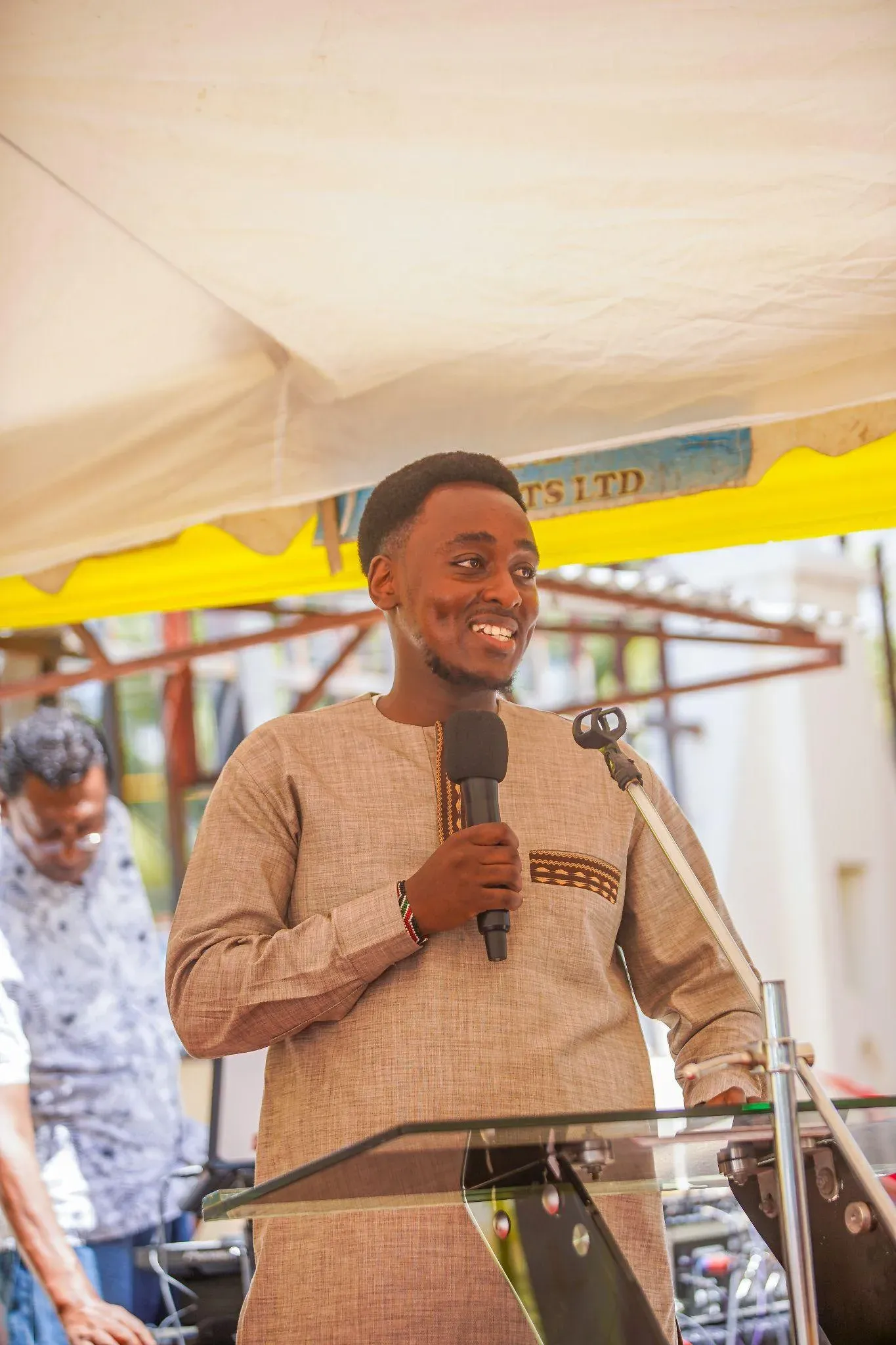 A speaker addressing guests at the Mombasa branch opening
